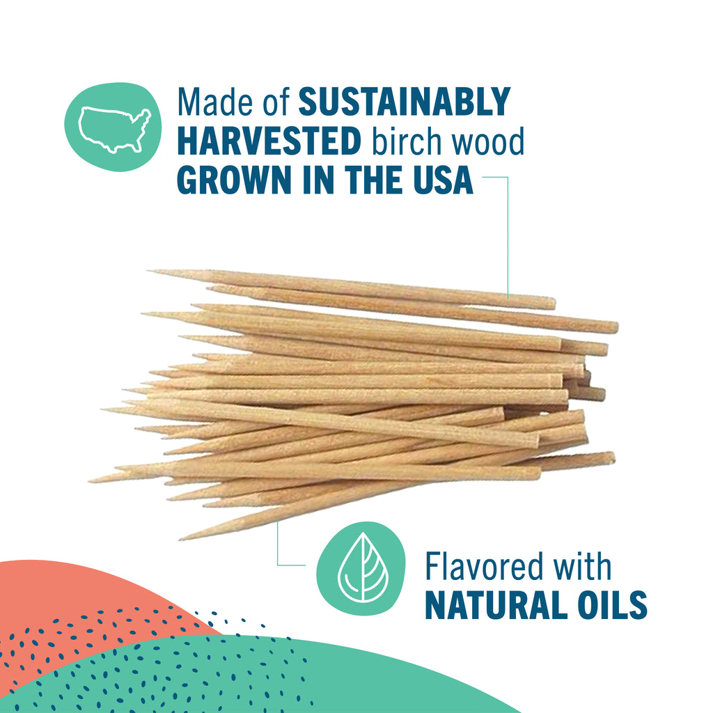 A pile of natural flavored toothpicks on a white background with informational text and icons. The text reads 'Made of SUSTAINABLY HARVESTED birch wood GROWN IN THE USA' and 'Flavored with NATURAL OILS.