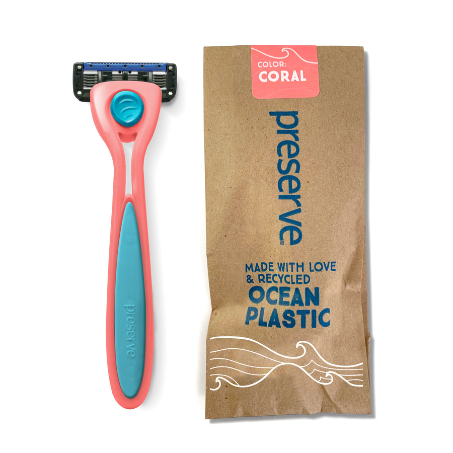 Image of a pink Preserve Shave 5 razor with Preserve packaging with the words "Color: Coral. Made With Love & Recycled Ocean Plastic."